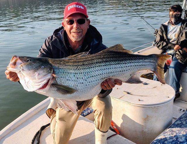 HOLY LAKE ALLATOONA! CONGRATULATIONS DOMINGO!  He caught it and let me hold it for a picture. They're out there everybody. Still have some openings this week and next weekend if anybody's interested. 770-815-9579
