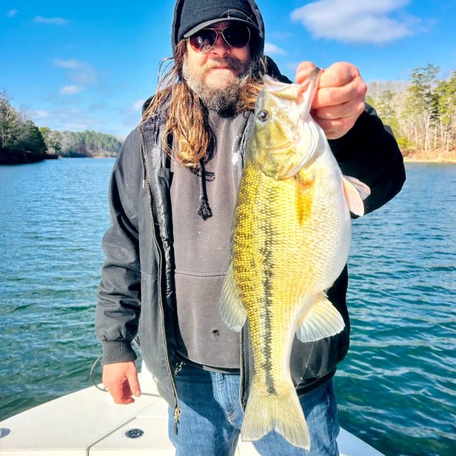 PIG OF A SPOT! On digital scales this spotted bass was almost 7 lb! Look at that belly! Some people ask how we consistently go out and do better than most. I let them know it's years of experience, having a great team to help each other out and practice/scouting! Every professional tournament fisherman not only has the knowledge but gets out on the water before tournaments to find fish. Unlike most guide services we do the same. When we are not guiding a lot of days we are out there finding fish to produce better for our guided trips. Here's a couple pictures of Derek and his buddy Jay on the water doing just that. They got rewarded with some nice stripers, hybrids and a bunch of bass. Including this trophy spot! Still have some votes available for Sunday and next week. Call to set your day up. 770-815-9579
